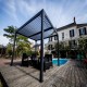 Pergola Bioclimatique aluminium anthracite 10,80 m2 et Toit avec lames ovales Habrita